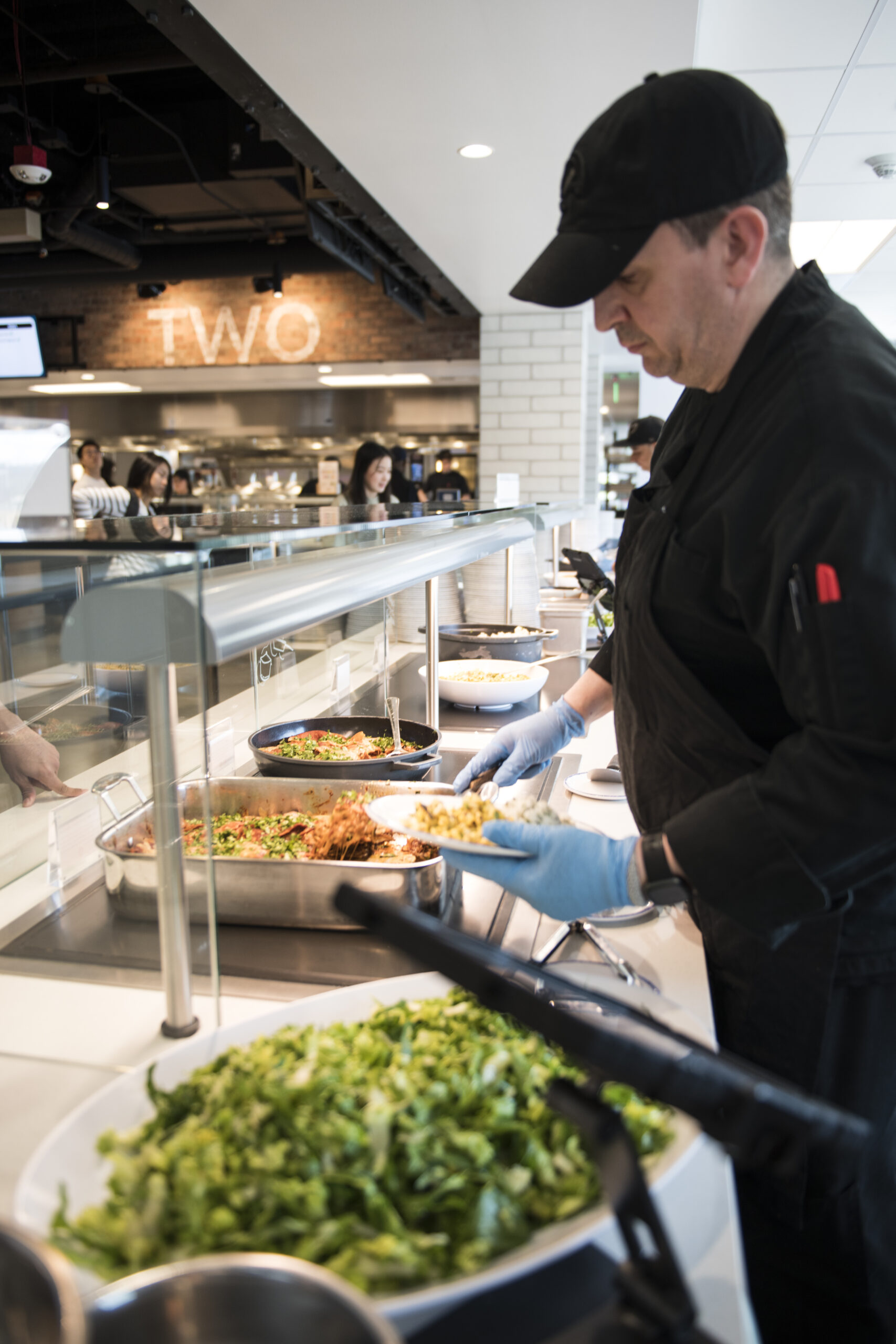Sifted chef serving lunch in an on-site workplace café